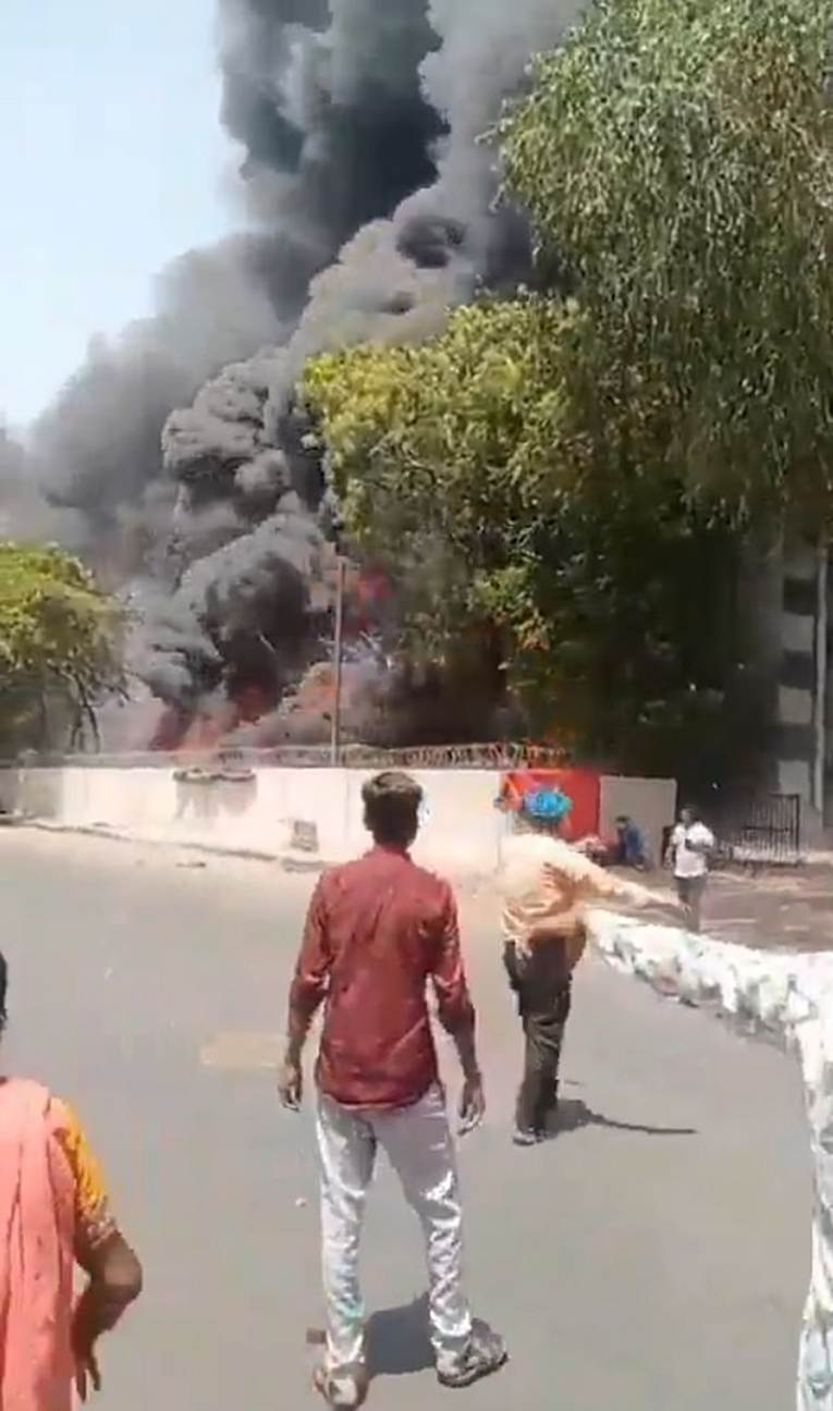 Astonishing new footage shows plane EXPLODE behind British Air India crash survivor as he calmly walks away while talking on his phone